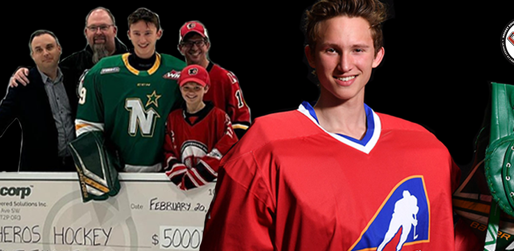 Image: Team Alberta Goaltender Ryley Budd stands with his Heroes Hockey cheque.